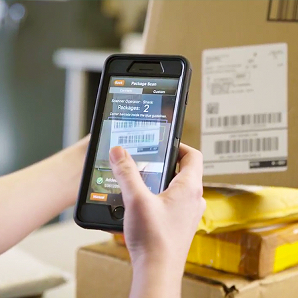 QTrak app on iPhone scanning package barcode
